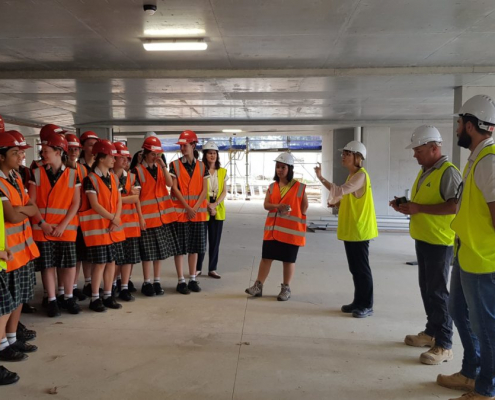 Brigidine College students standing in building being constructed