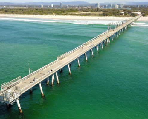 Aerial view of the bridge over the blue ocean